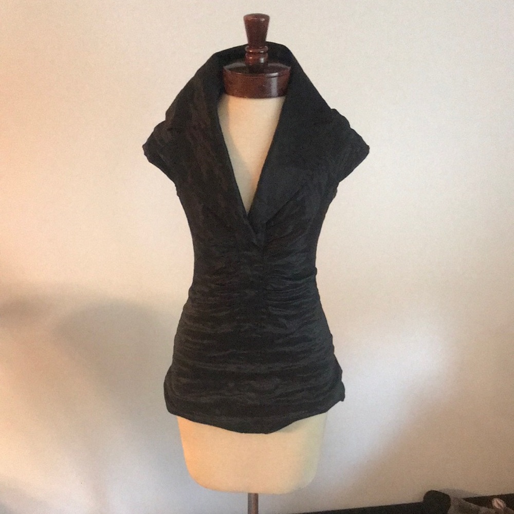 Black with a shimmer close fitting top with oversized collar